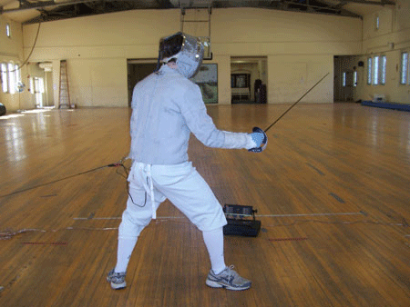 A fully-equipped sabre fencer.